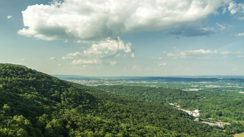 View of countryside landscape against cloudy sky