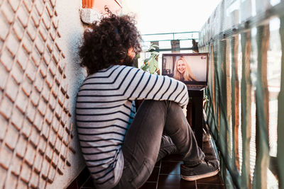 Man on video call with friend