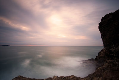 Scenic view of sea against sky at sunset