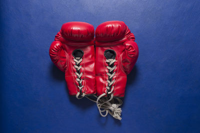 High angle view of red boxing gloves on table