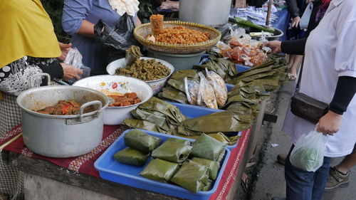 People at market stall