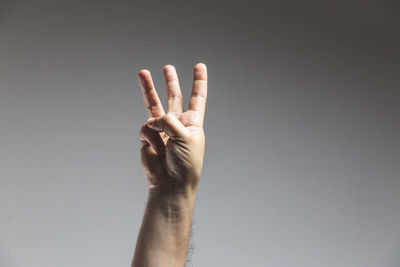 Close-up of human hand against black background