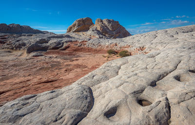 Rock formations on land against sky