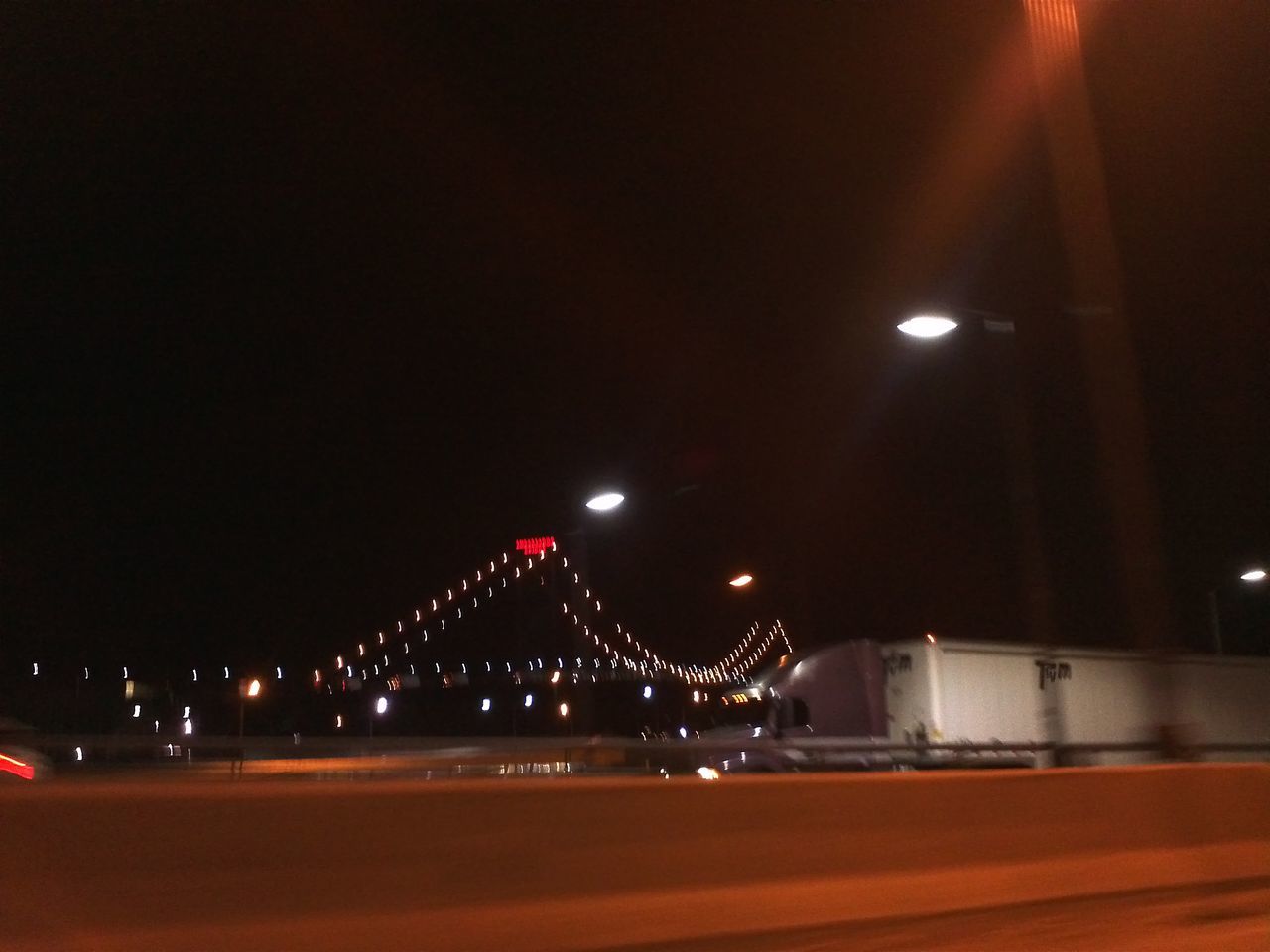 illuminated, night, transportation, built structure, architecture, street light, road, car, city, street, land vehicle, lighting equipment, bridge - man made structure, building exterior, light trail, mode of transport, long exposure, sky, connection, the way forward