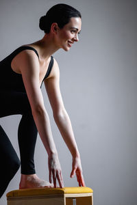 Young woman exercising at gym