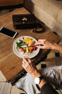 High angle view of man preparing food