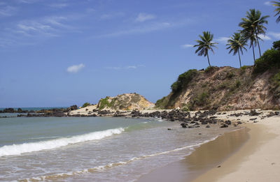 Scenic view of beach against sky