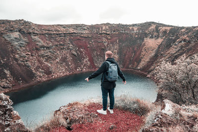 Full length of man standing on rock