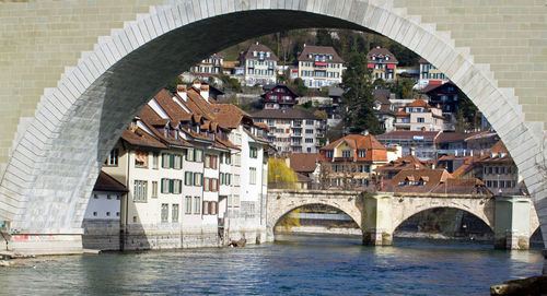 Arch of nydegg bridge over aare river in bern city