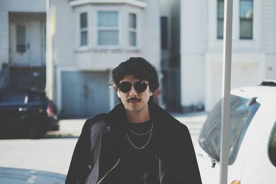 Portrait of young man wearing sunglasses outdoors