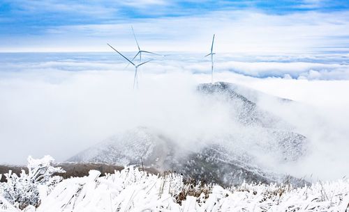 Scenic view of snowcapped mountains against sky