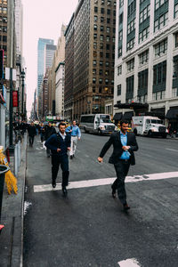 Woman standing on city street