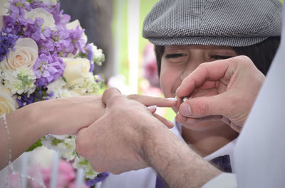 Portrait of man holding flower bouquet