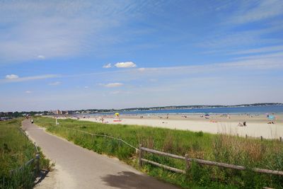 View of beach against cloudy sky