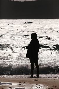 Full length of silhouette man standing on ground