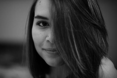 Close-up portrait of a smiling young woman