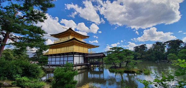 Low angle view of golden pavilion against sky