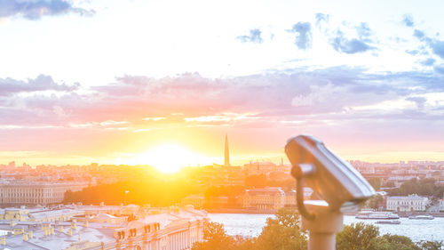 Panoramic shot of buildings against sky during sunset