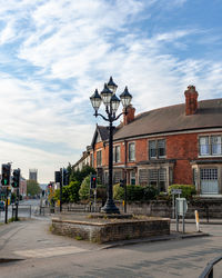 A lamppost with 5 lamps in derby that gives rise to a mame of the city centre district.