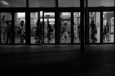 People in corridor of building