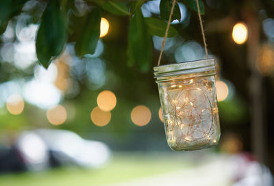 Close-up of illuminated light bulbs in jar