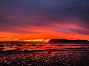 Scenic view of sea against romantic sky at sunset