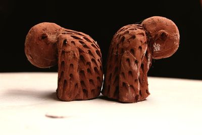 Close-up of chocolate on table against black background