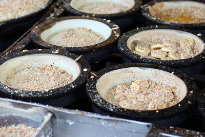 Traditional malaysian street food apam balik - thick soft pancake with peanuts, bananas.