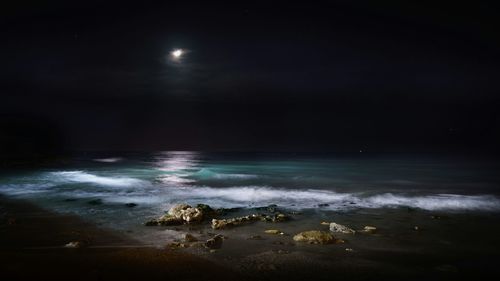 Scenic view of sea at night