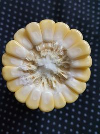 High angle view of yellow eggs in container