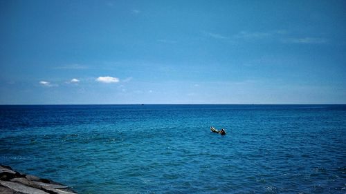 Scenic view of blue sea against sky