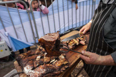 Midsection of man preparing food