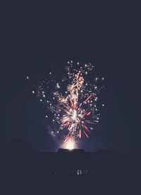 Firework display at night