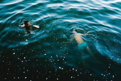 High angle view of boys swimming in lake