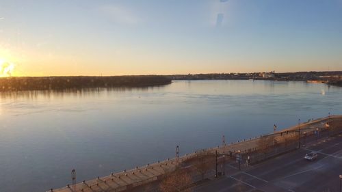 Scenic view of river at sunset