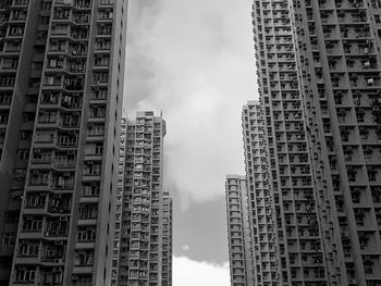 Low angle view of buildings in city against sky