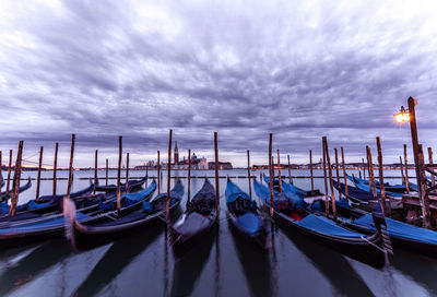 Boats moored at harbor