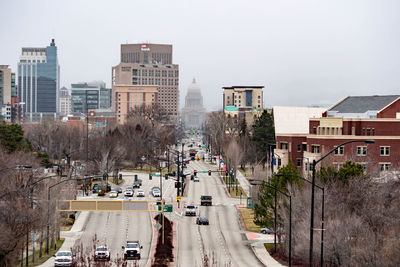 High angle view of street amidst buildings against sky