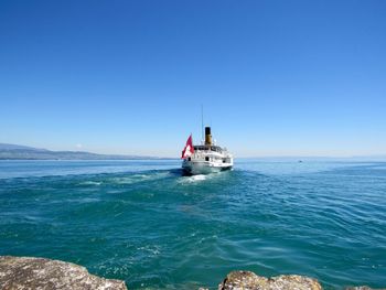 Low angle view of boat sailing in sea