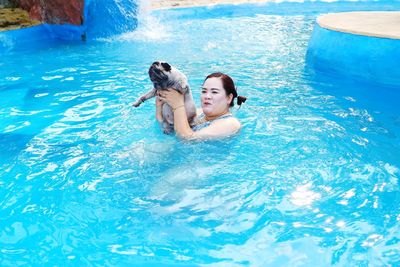 Woman enjoying in swimming pool