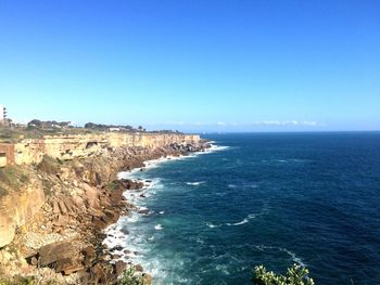 Scenic view of calm sea against clear sky