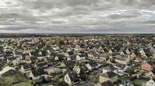 Aerial view of a settlement with houses from the 1950s, desaturated