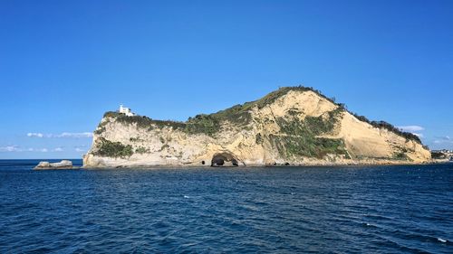 Scenic view of sea against clear blue sky