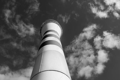 Low angle view of lighthouse against cloudy sky