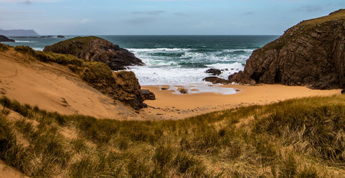 Scenic view of beach against sky