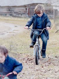 Full length of boy on bicycle