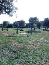 Trees in park against sky