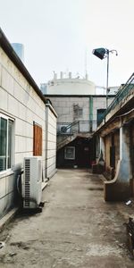 Street amidst buildings against sky