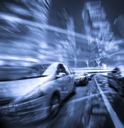 Blurred motion of light trails on road in city