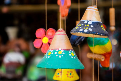 Close-up of multi colored decorations hanging for sale in market